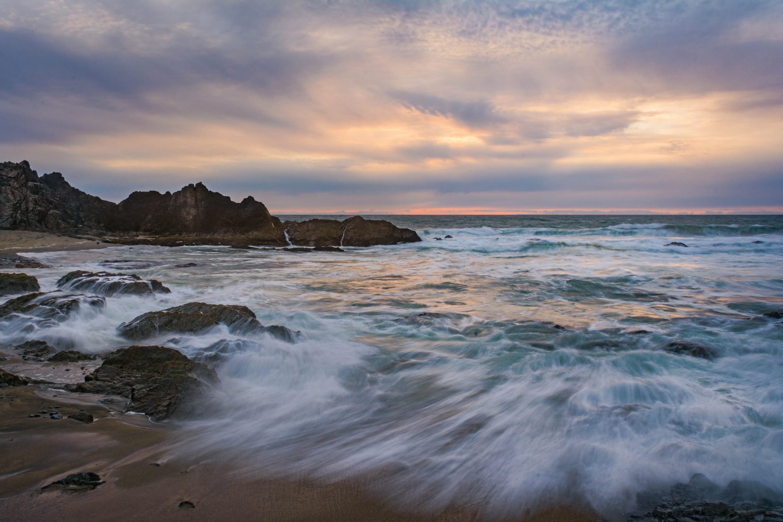 McClure's Beach, California with waves, rocks and sunset