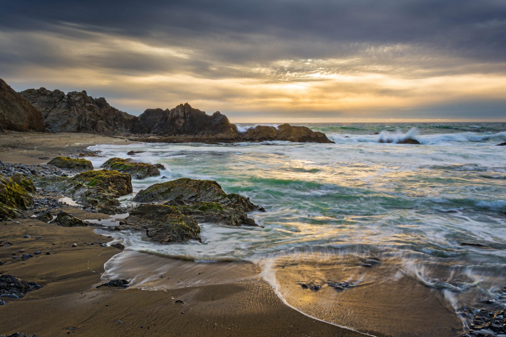McClure's Beach, California with waves, rocks and sunset
