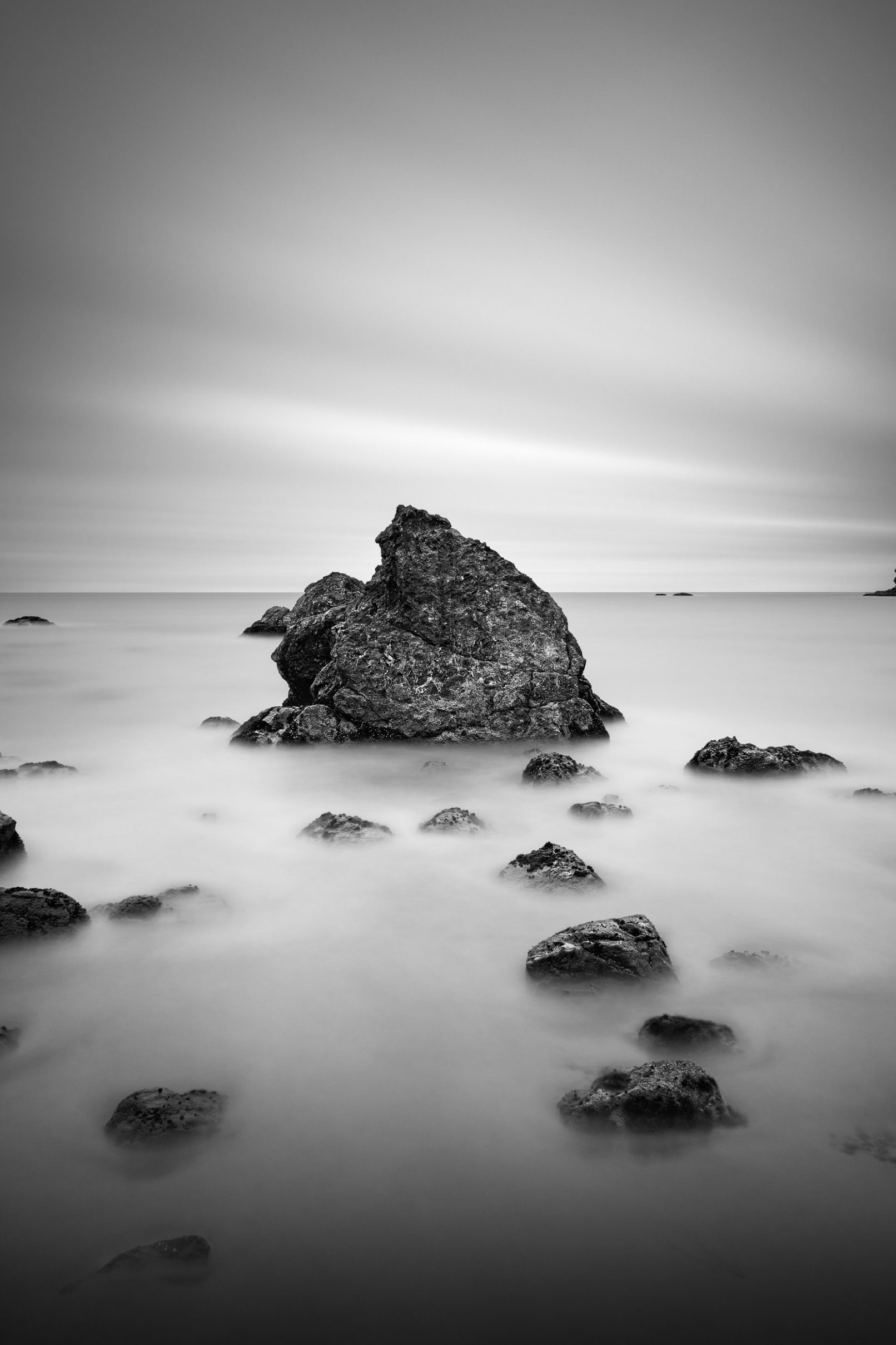 Muir Beach rocks with streaked clouds