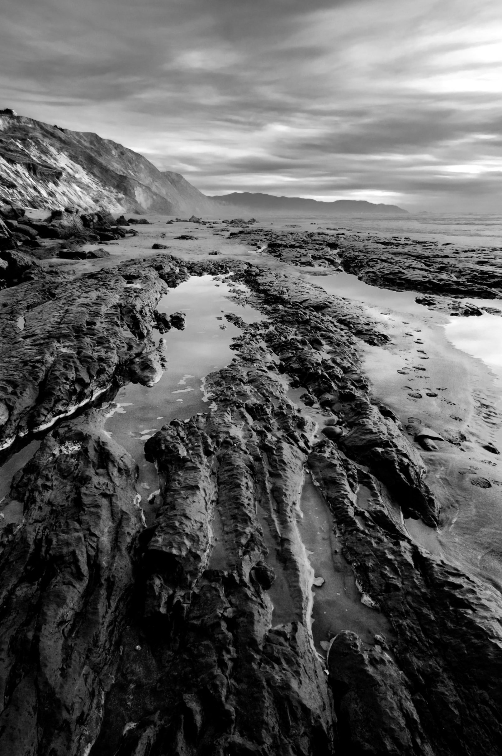 Beach with rocks and clouds