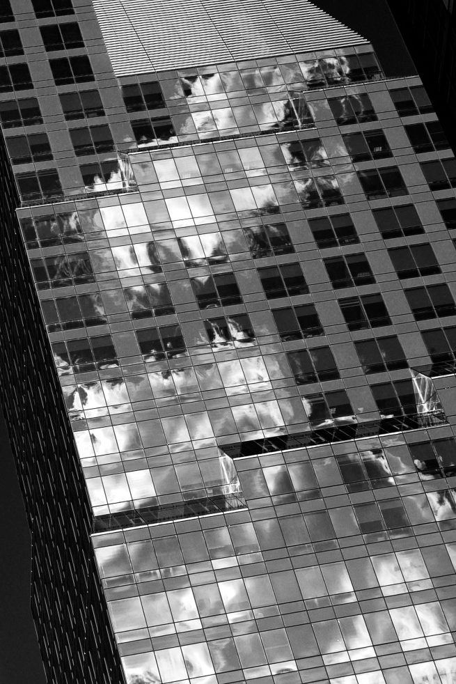 New York City Building with clouds reflecting off windows
