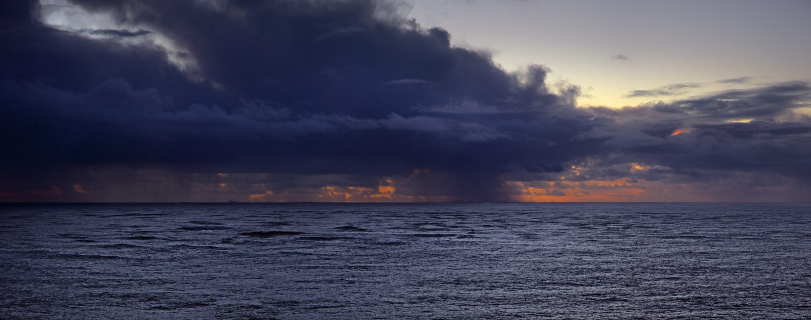 Storm clouds over Pacific at sunset