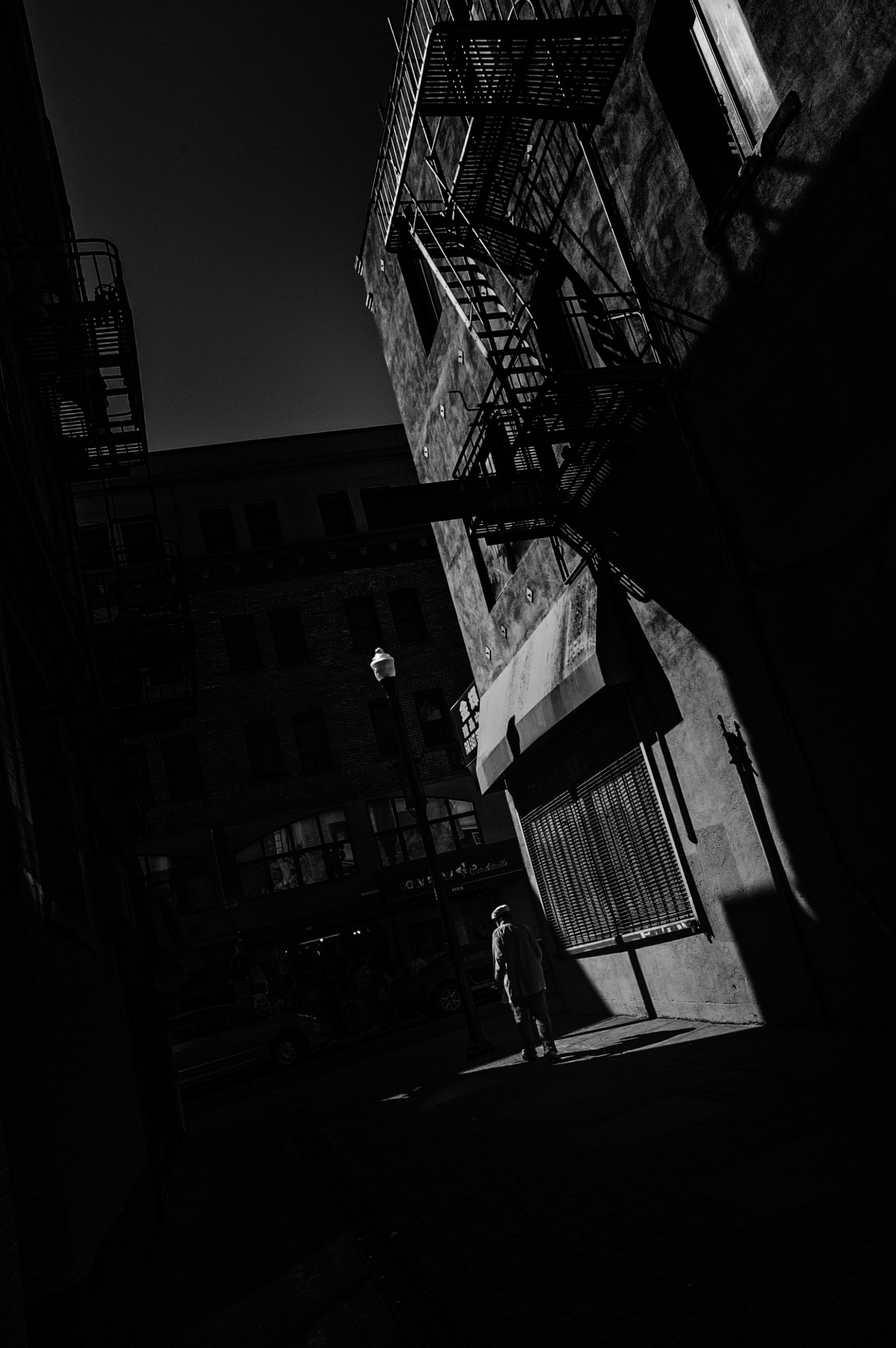 Old man on with dark shadows on San Francisco street