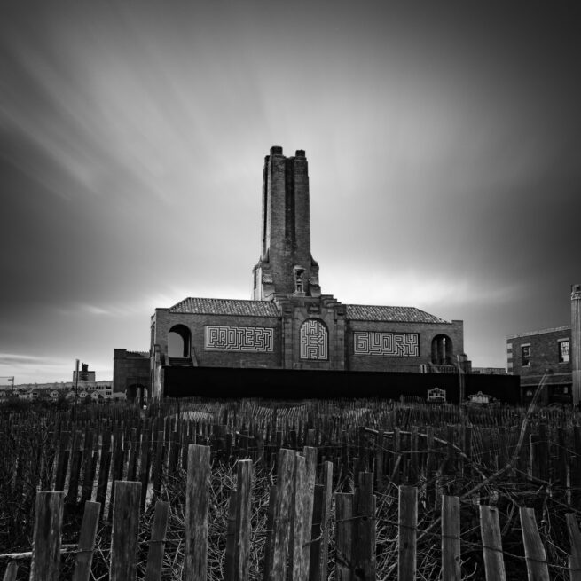 Old brick building in Ocean Grove, New Jersey with streaked clouds