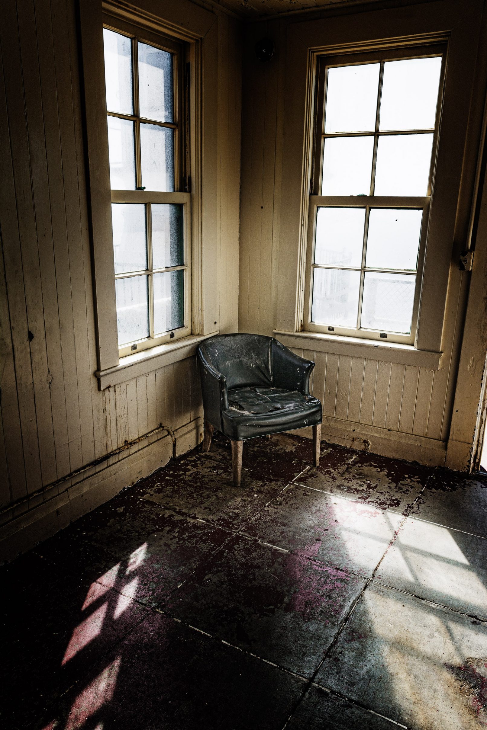 Old chair at Point Reyes Lighthouse with bright windows