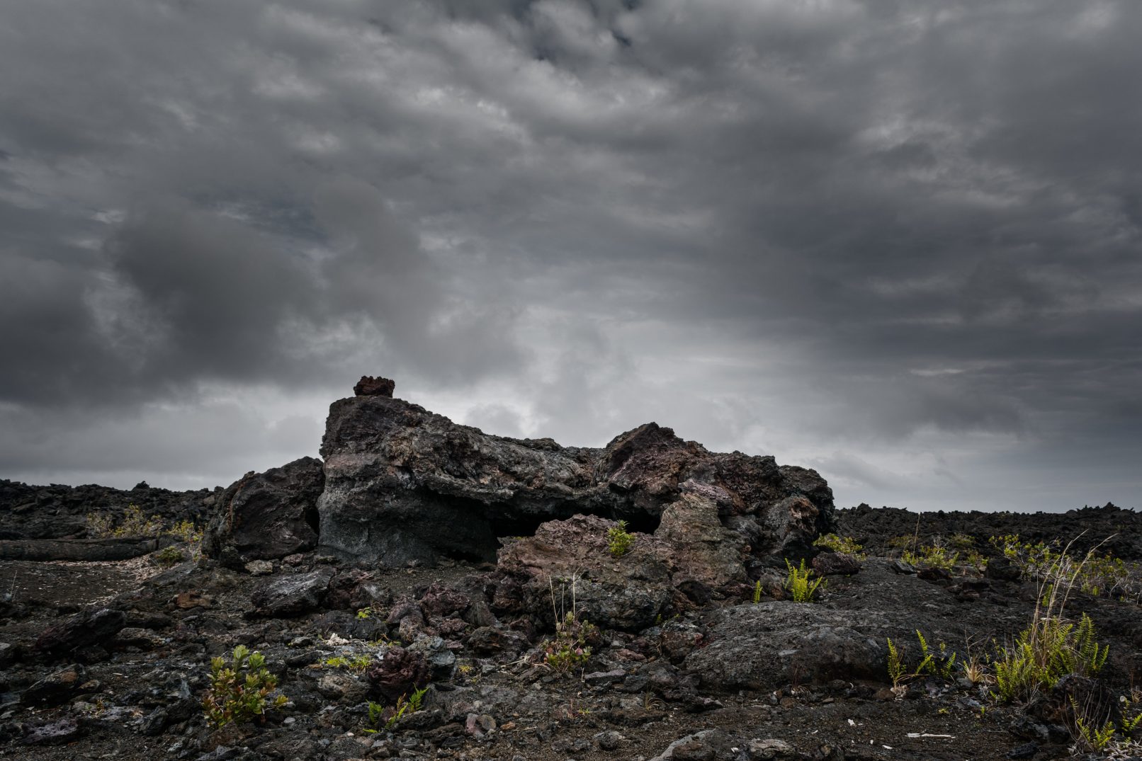 Hawaii lava rock with stormy sky
