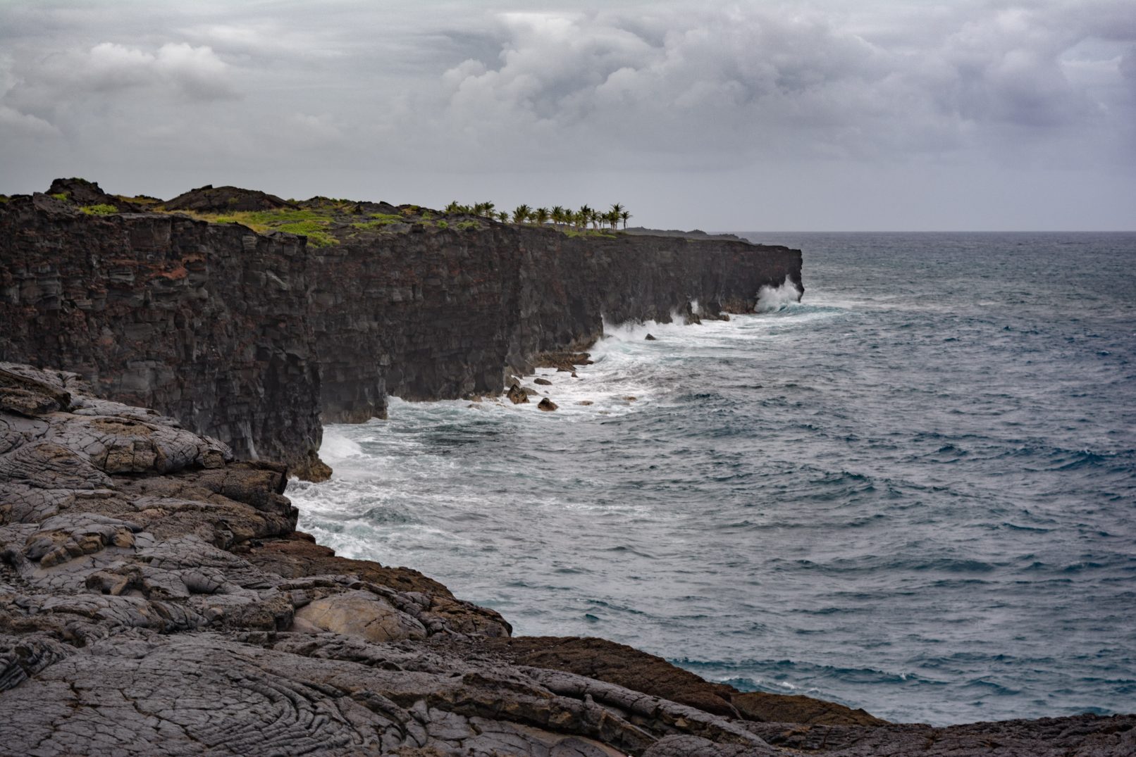 Hawaii coast with lava rock cliffs