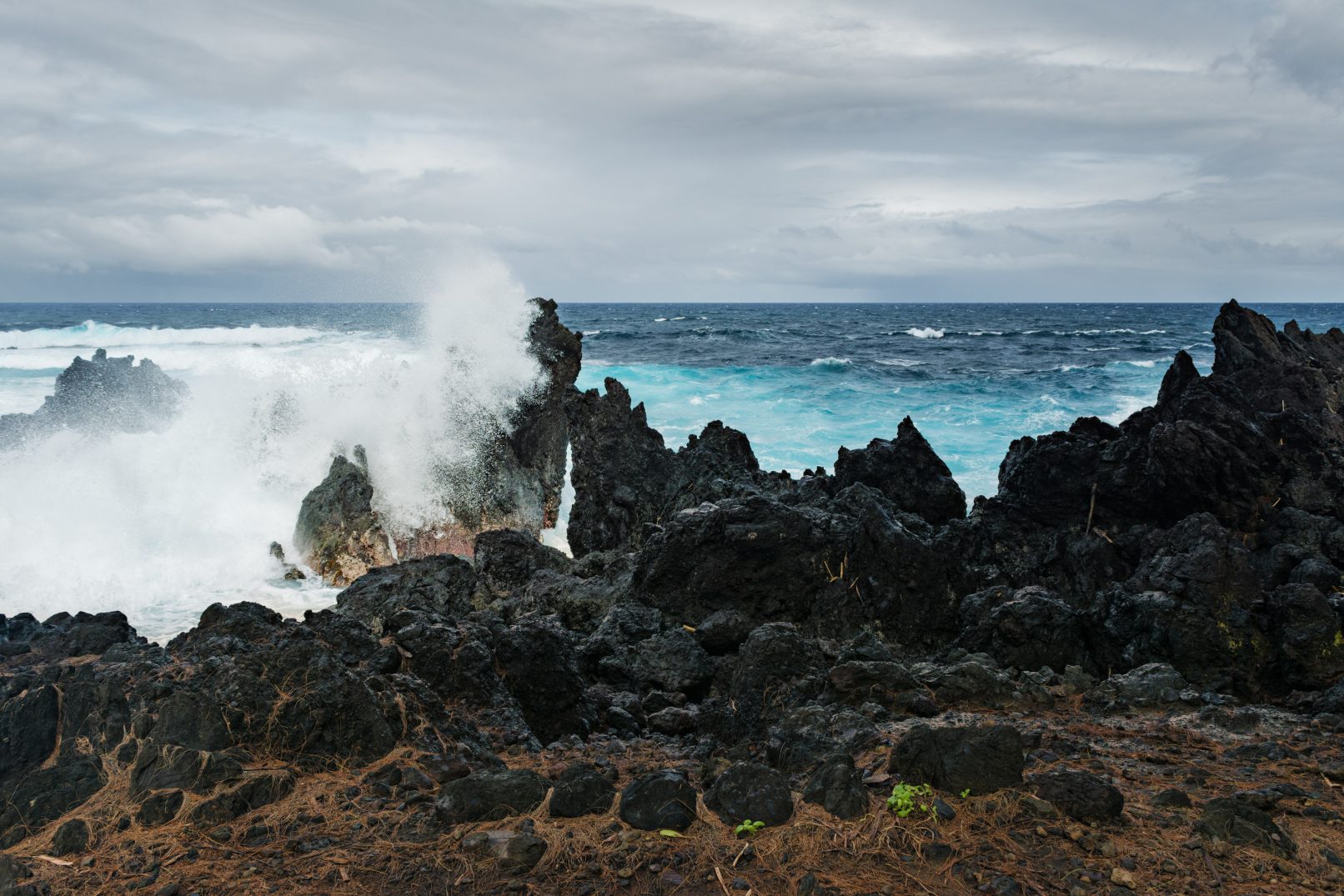 Hawaii wave crashing into rocks