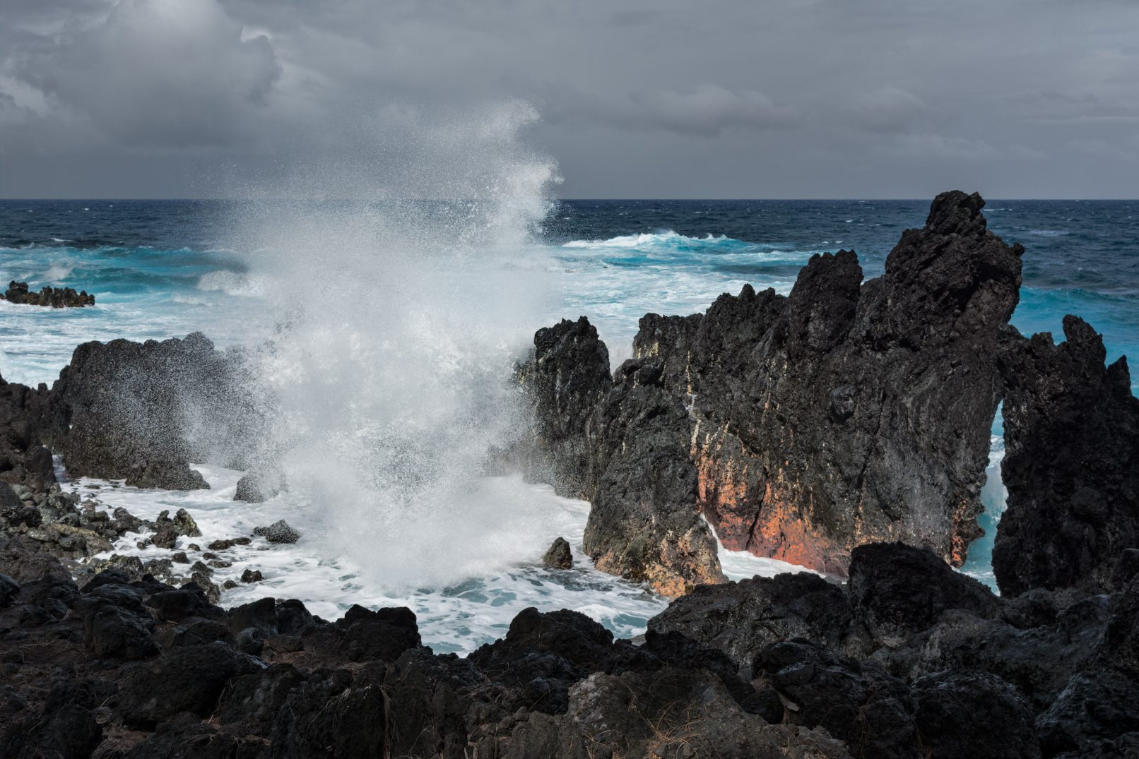Hawaii wave crashing into rocks