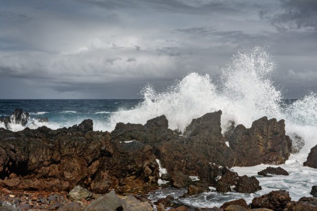 Hawaii wave crashing into rocks