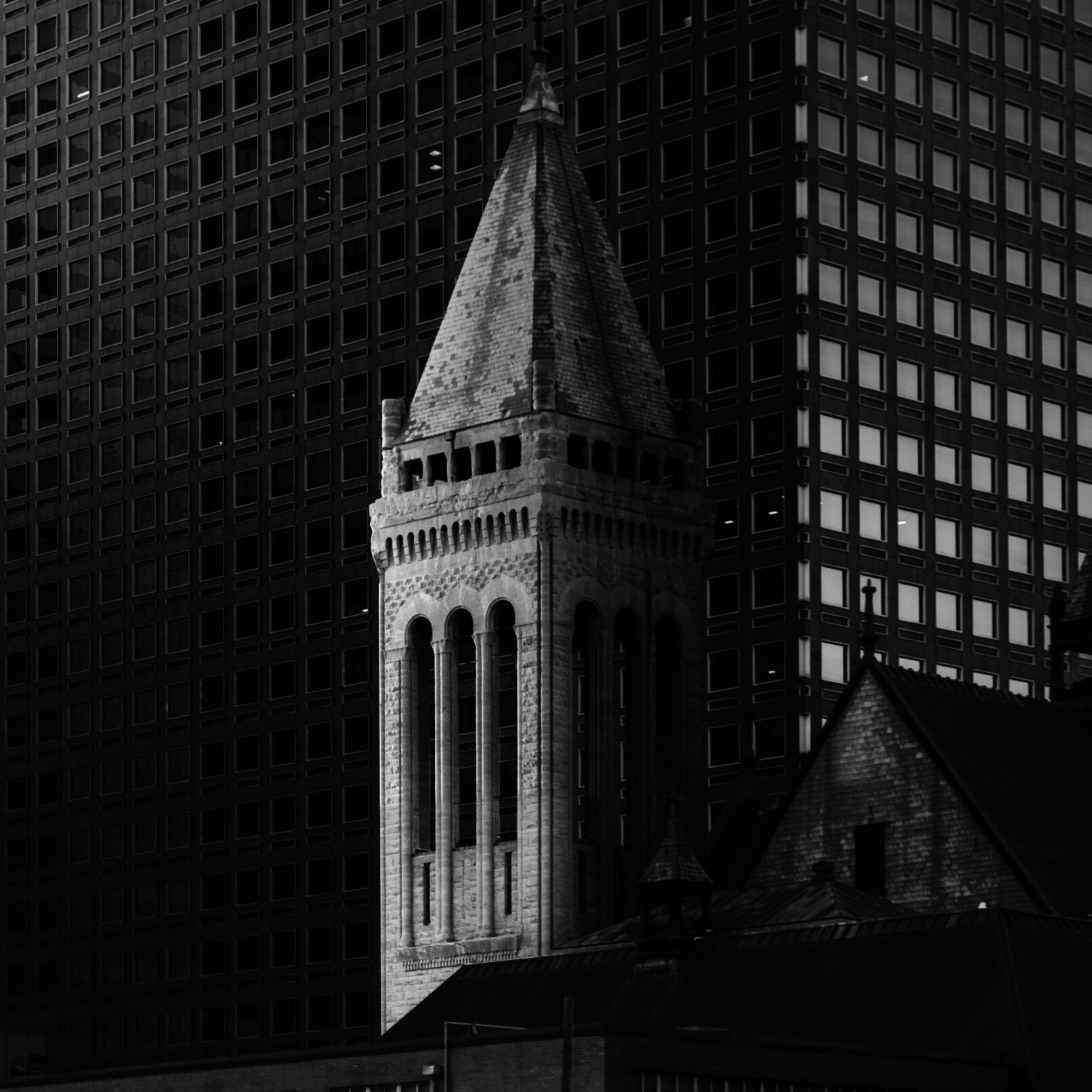 Old Denver building in front of skyscraper