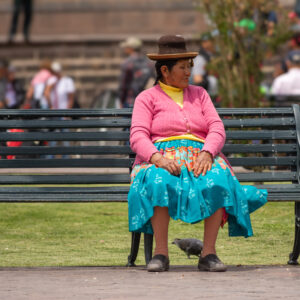 Woman on bench in Cusco, Peru