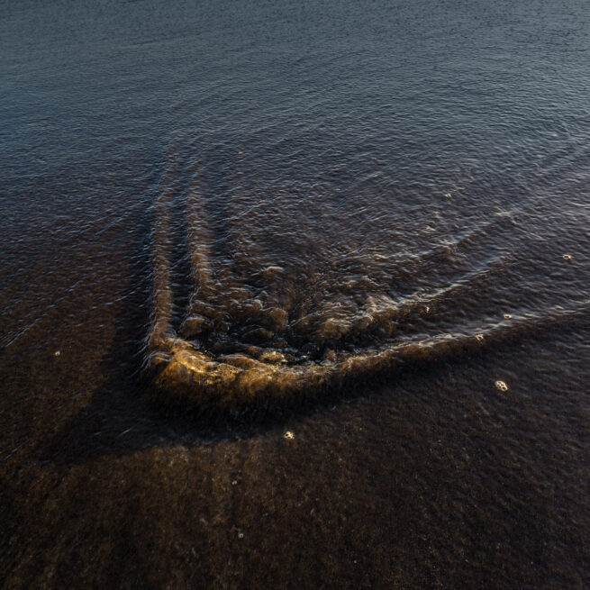 Stone Under Receding Water