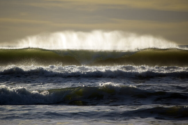 Ocean waves backlit by sun