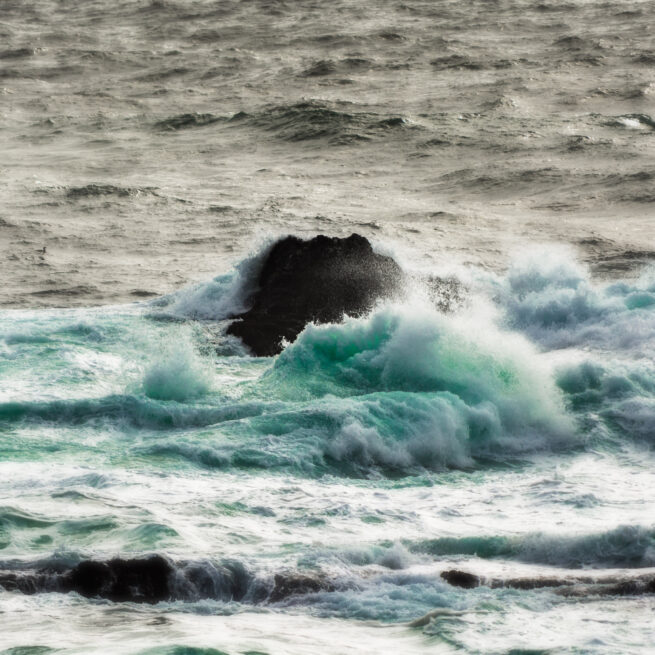 Ocean rock with crashing waves