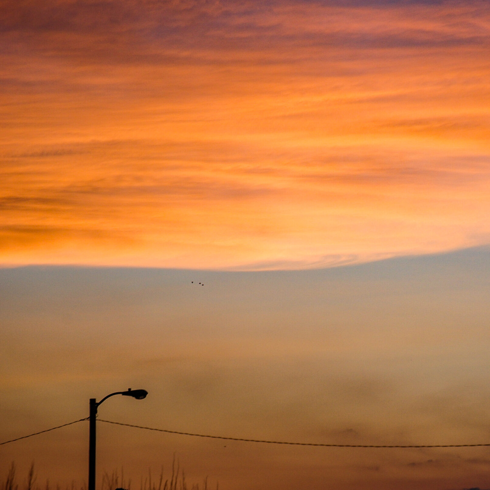 Streetlamp with orange sunset