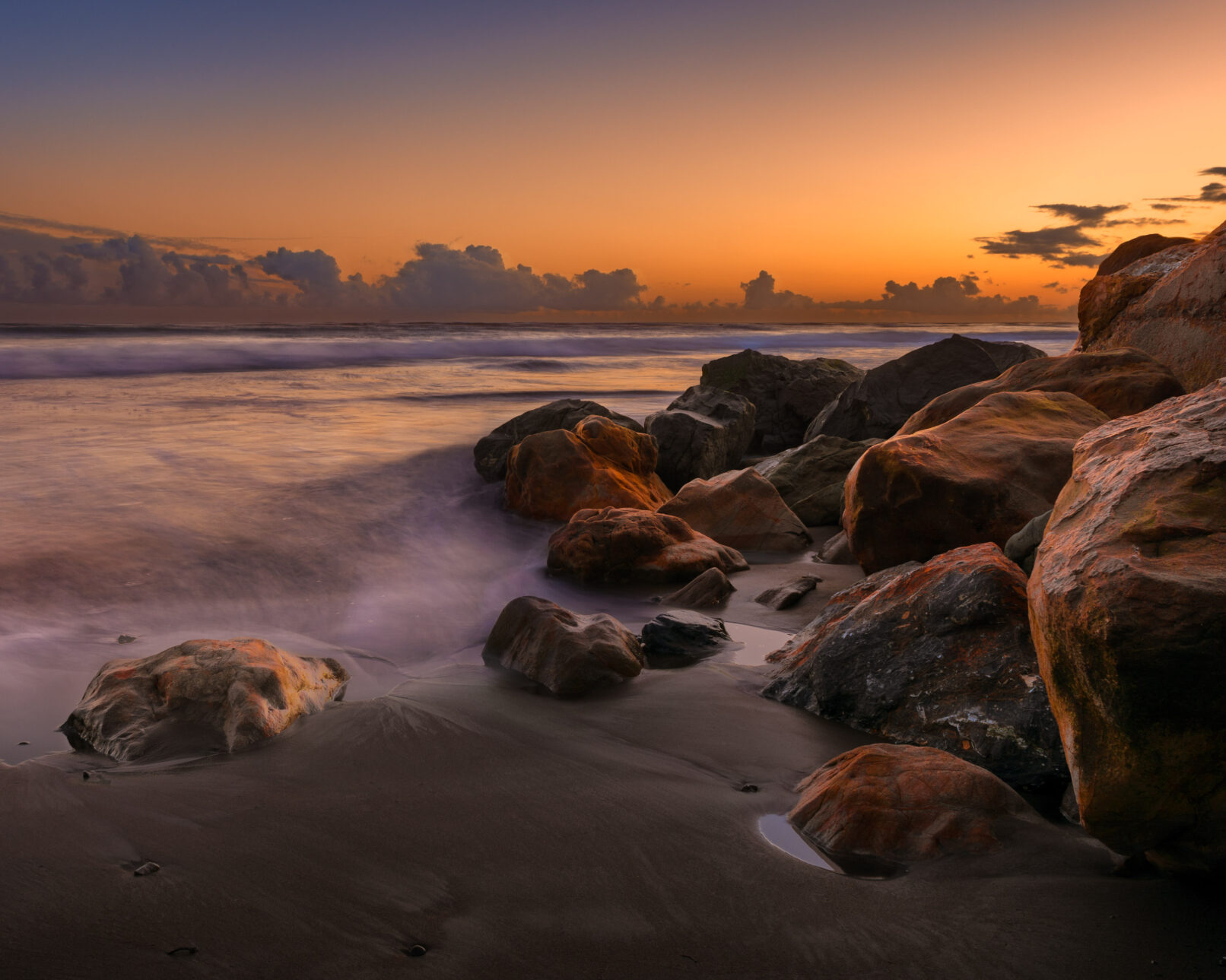 Beach rocks at sunset